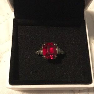 Silver ring with red ruby